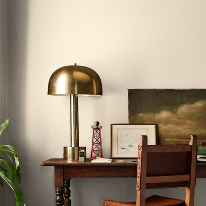 Morning Snow paint featured in office area wall with brass lamp, wood table and desk chair, pictures