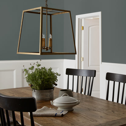 Ridge Rock paint featured in dining room walls with large brass pendant light and wooden dining table