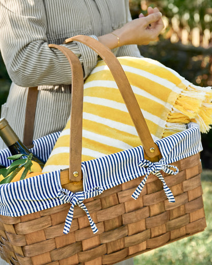 Kansas Handwoven Picnic Basket shown holding icnic supplies