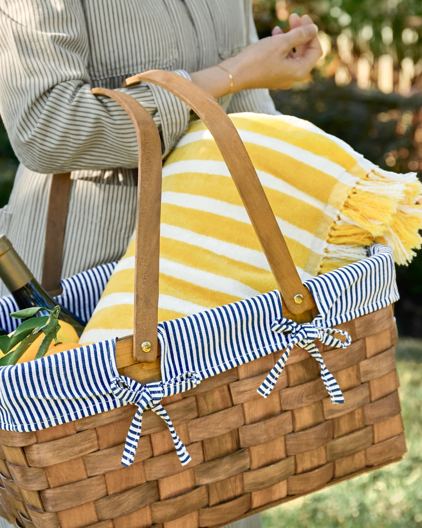 Monaco Mimosa Stripe Beach & Picnic Blanket shown in picnic basket