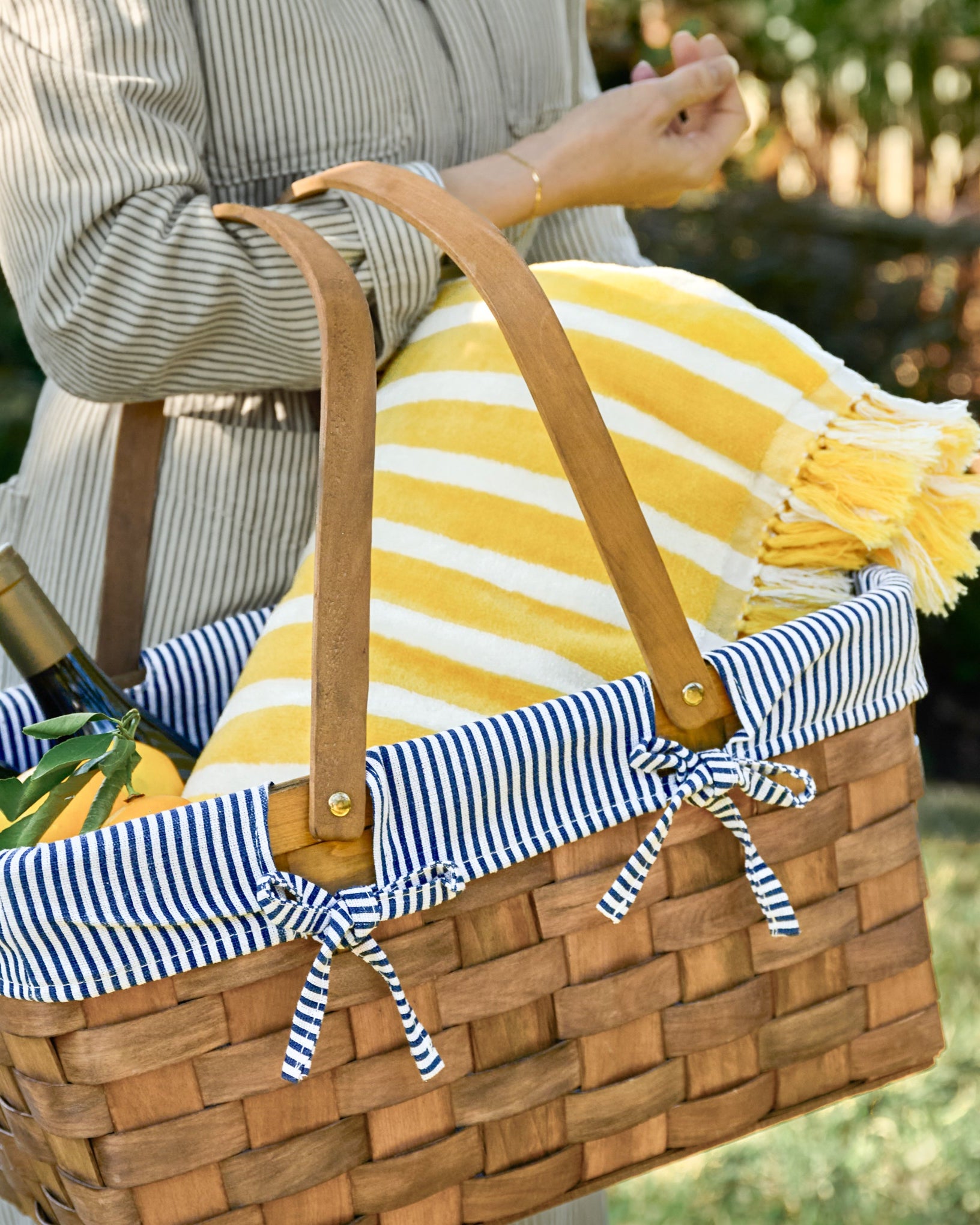 Monaco Mimosa Stripe Beach & Picnic Blanket shown in picnic basket