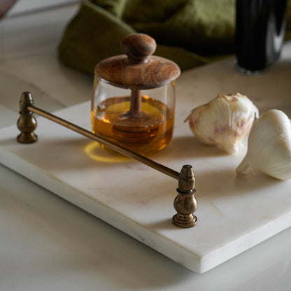 Honey Dipper Lidded Jar on a marble serving board