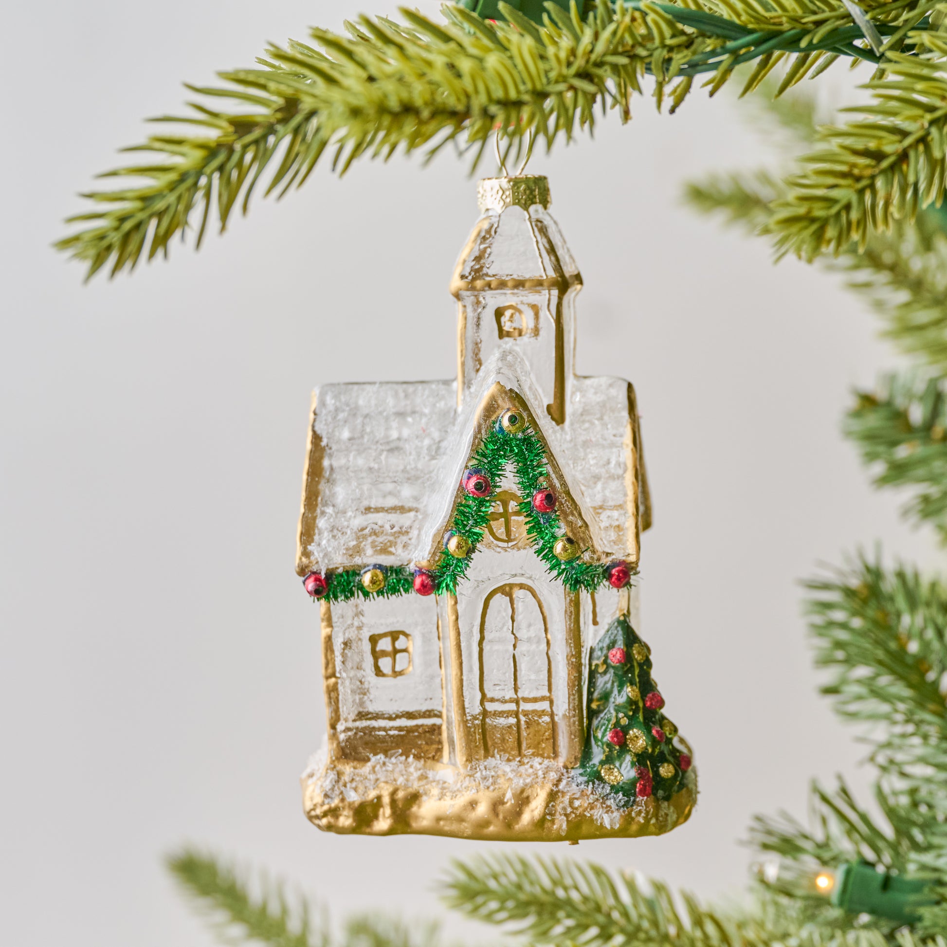 Gold Glass Church Ornament shown on tree