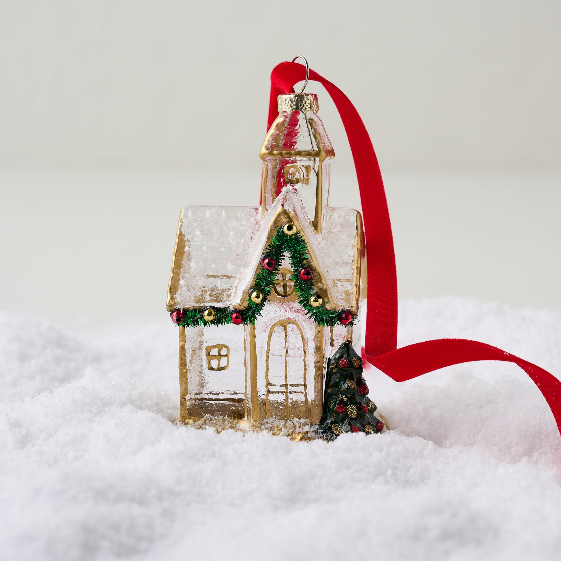 Gold Glass Church Ornament shown in snow