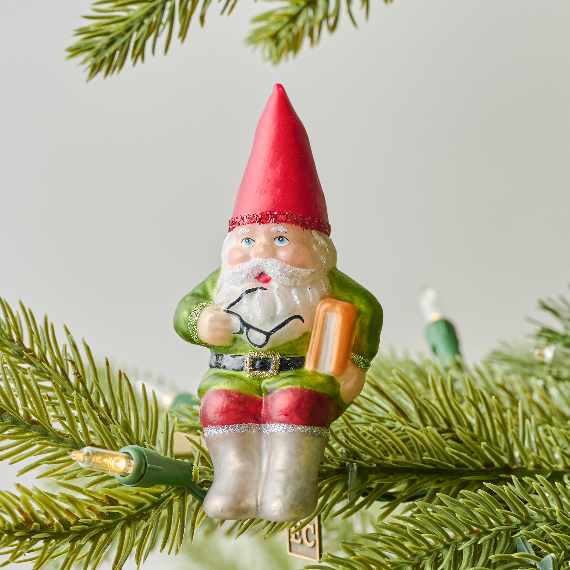Garden Gnome Ornament Clip shown on christmas tree branch