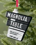 Magnolia Table Blown Glass Ornament shown on tree
