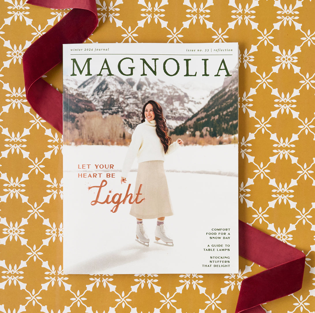 Magazine titled 'Magnolia' with a woman in a snowy landscape on a decorative yellow and white patterned background.