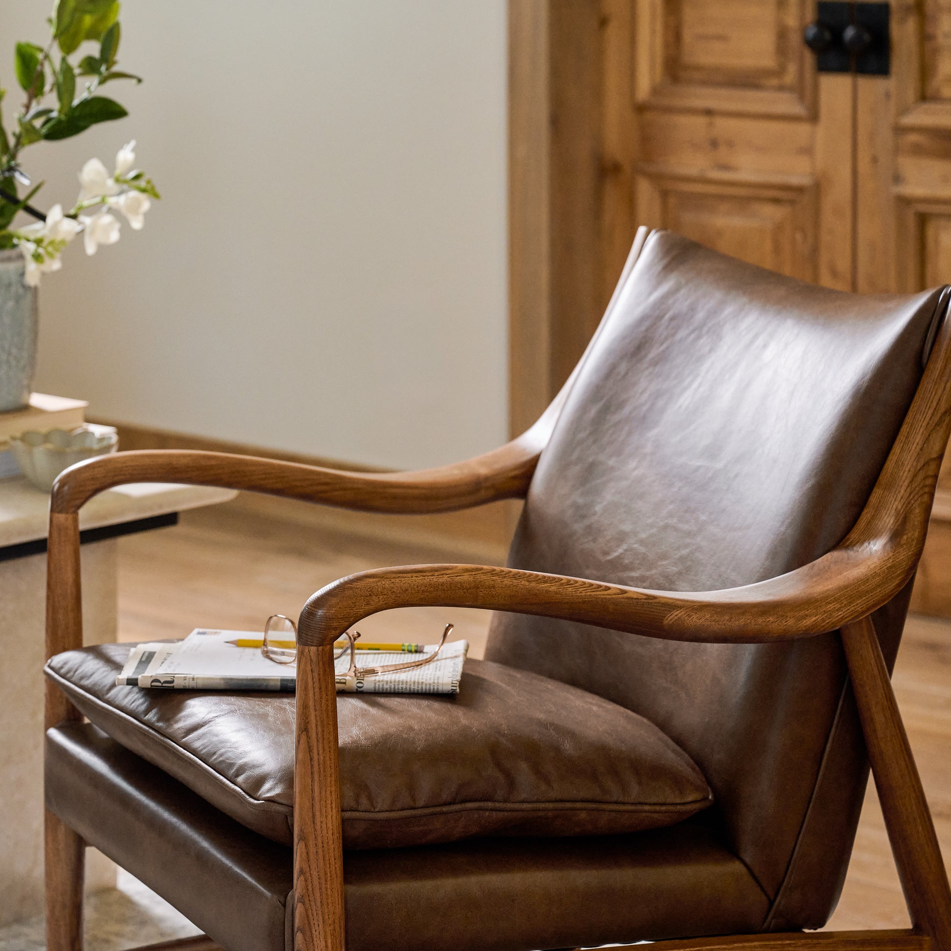 Holland Chair in a living room with a newspaper and reading glasses on the seat