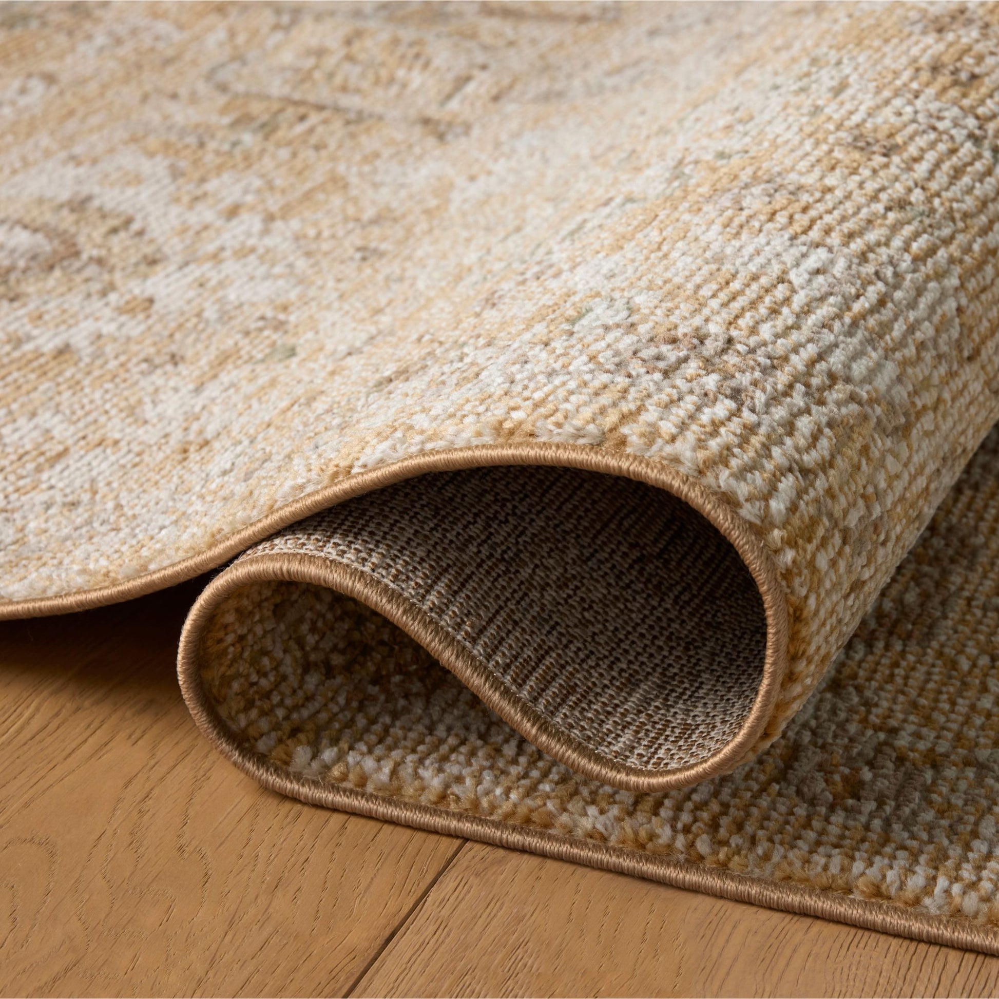 Pace Sunset Stone Rug shown rolled/folded