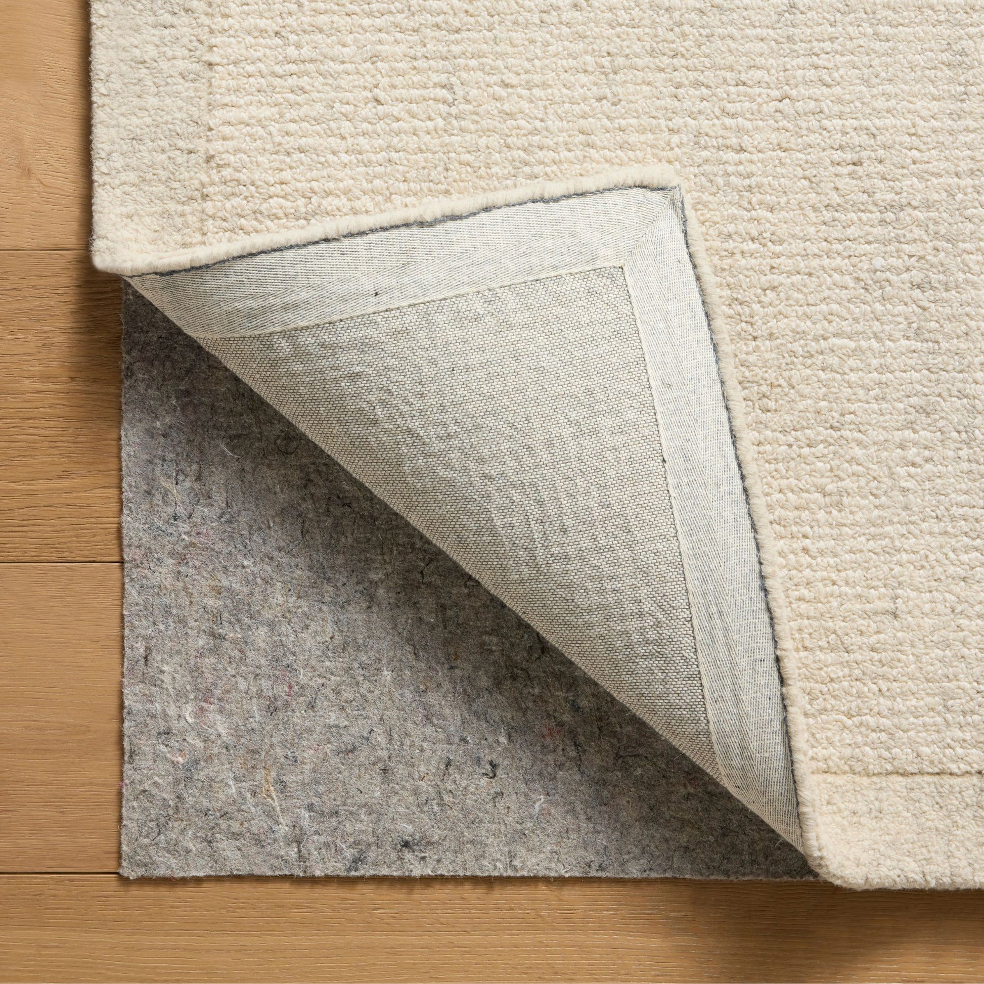 Henley Ivory Smoke Rug corner shown folded up
