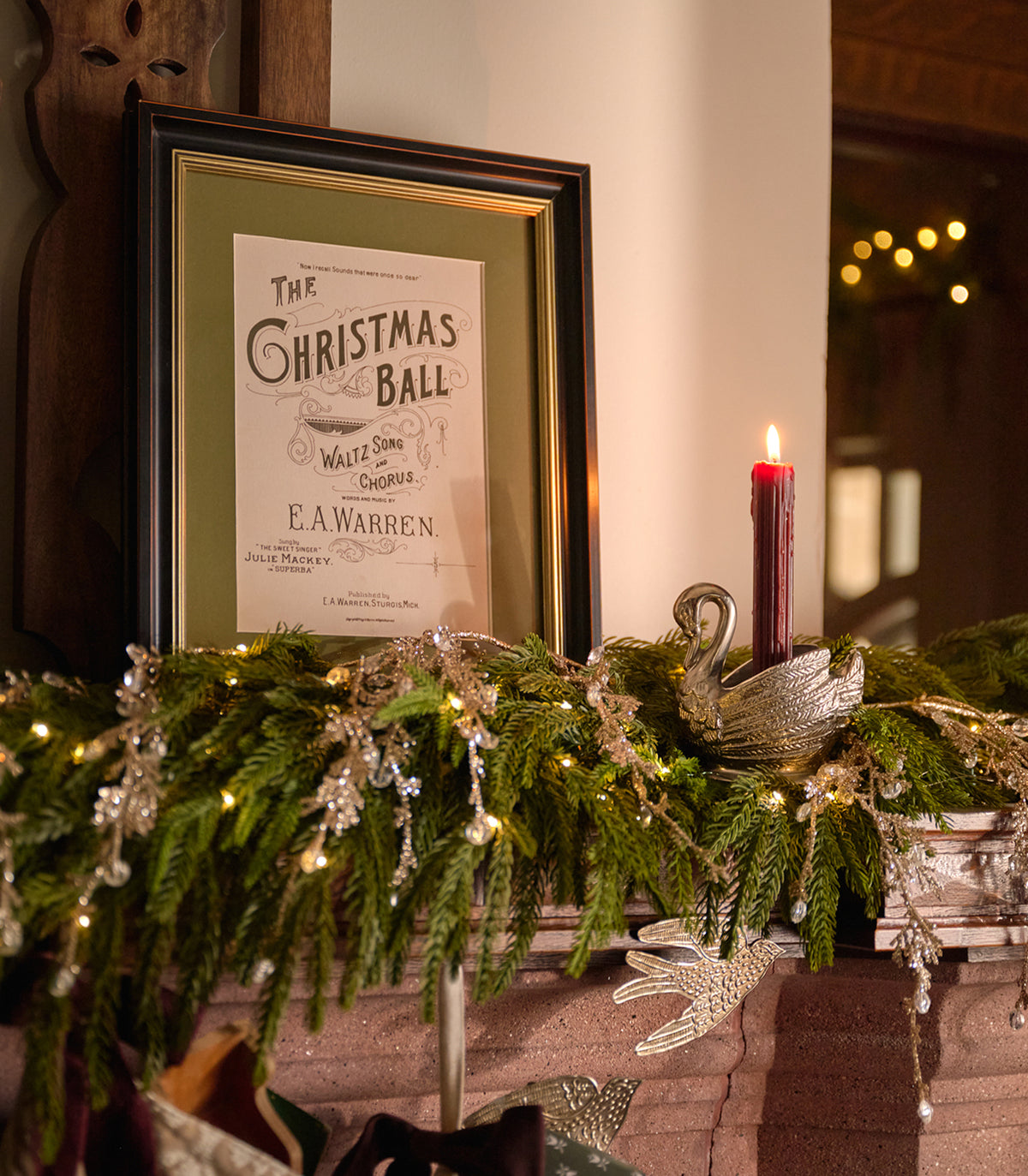 A framed vintage sheet music print for 'The Christmas Ball' by E.A.