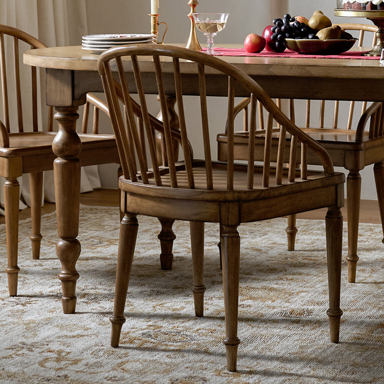Wooden dining table with chairs in a room setting