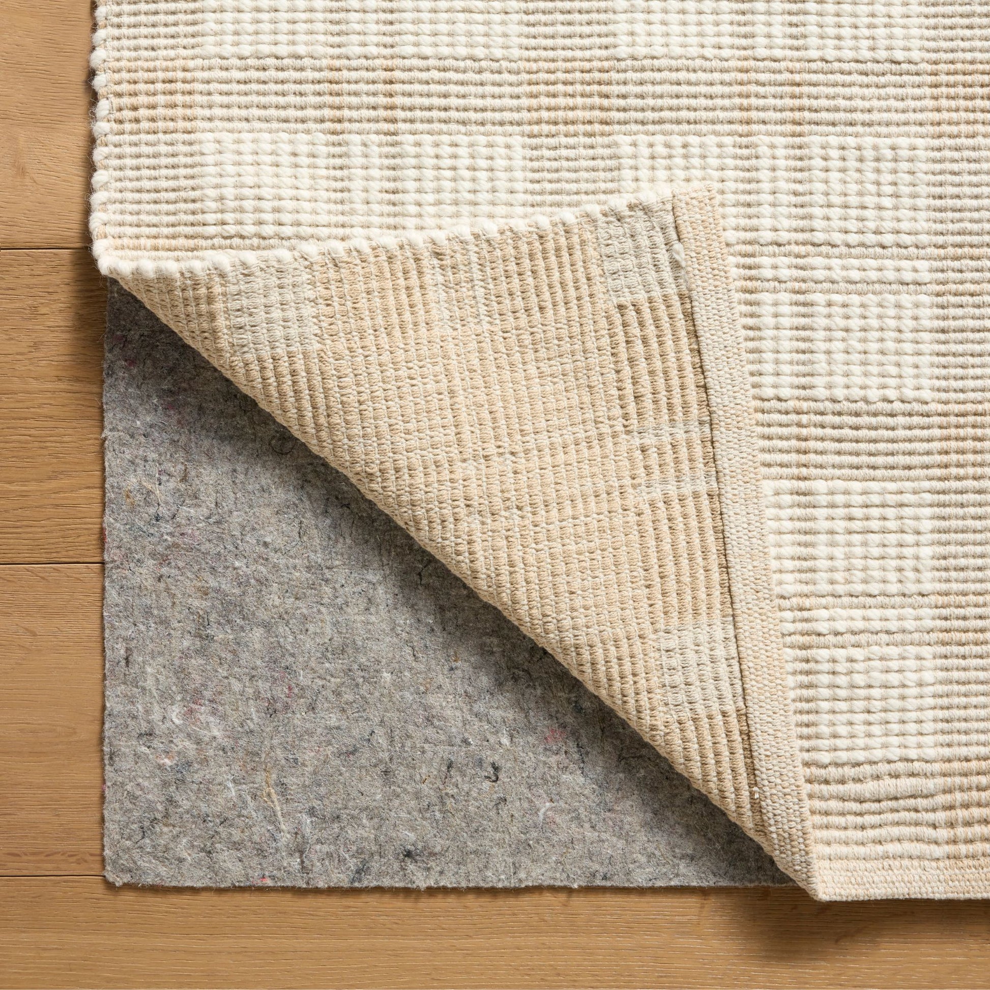 Ryder Beige Ivory Rug corner shown flipped
