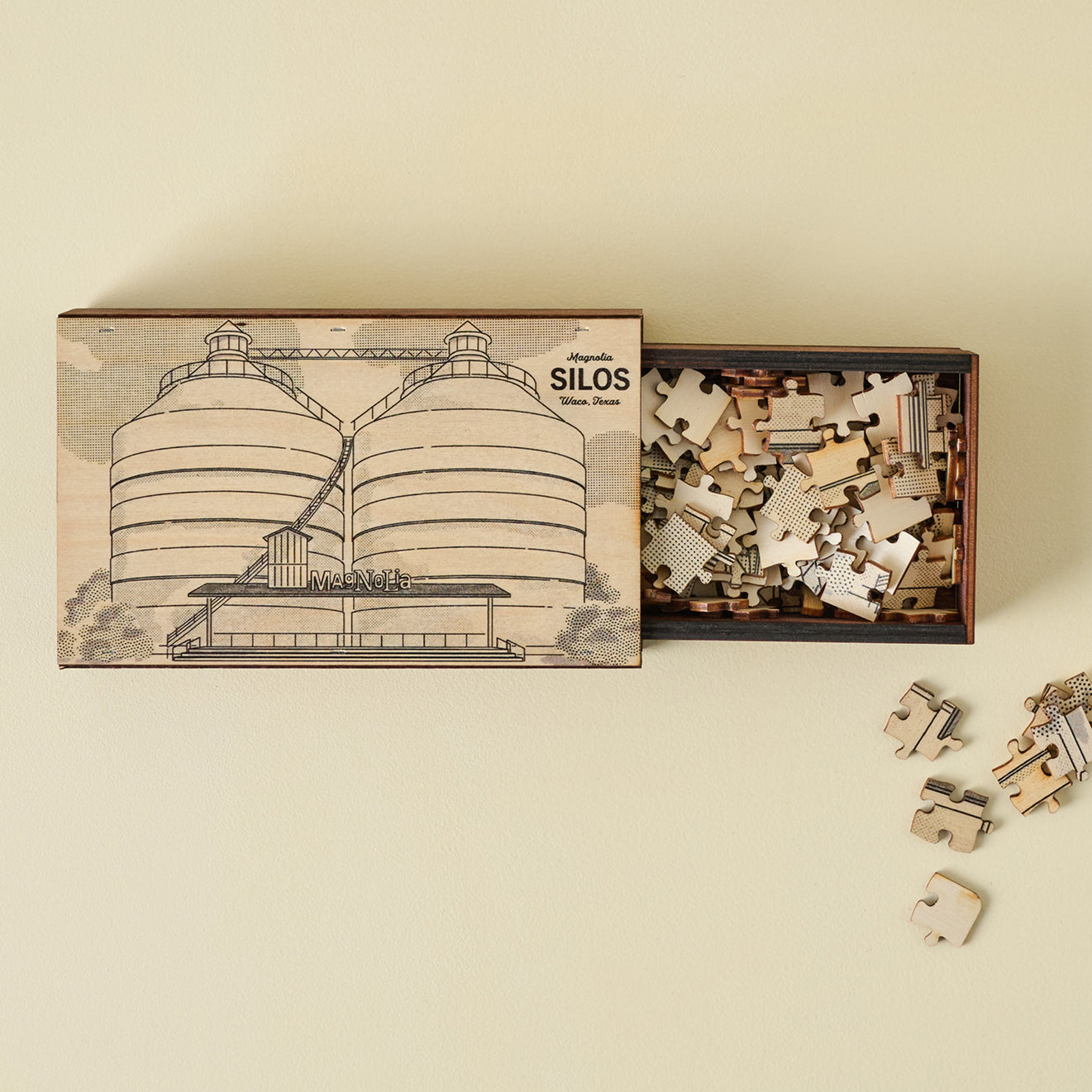 Jigsaw puzzle set with box featuring silo design on a beige background.  shop Magnolia souvenirs.