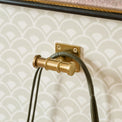 Louis Brass Wall Hook shown hung on wall