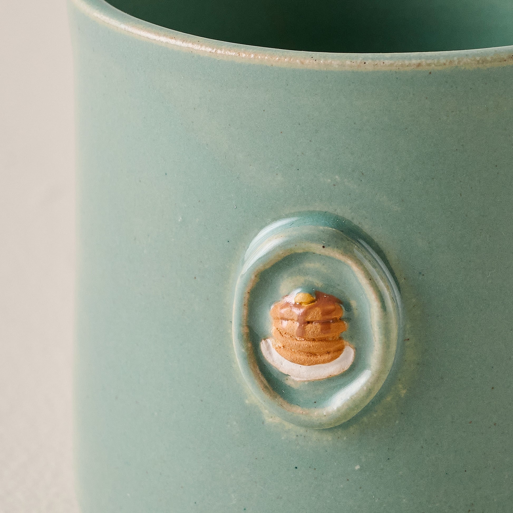 Black Oak Magnolia Table Pancake Mug up close