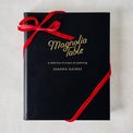 Leather Bound Magnolia Table Cookbook with ribbon around