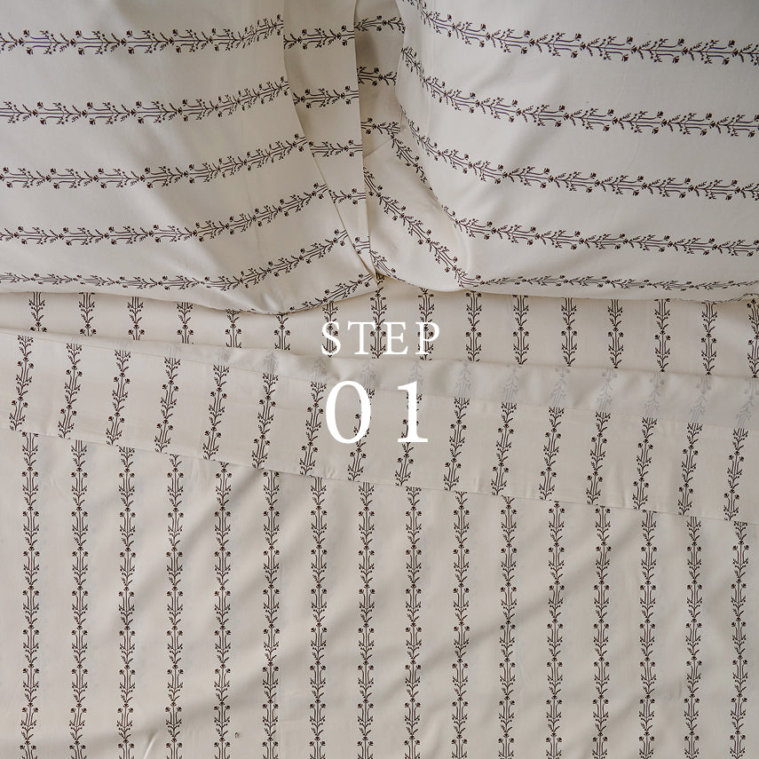 Textured fabric with a subtle pattern and 'STEP 01' text overlay.  Shop sheet sets.