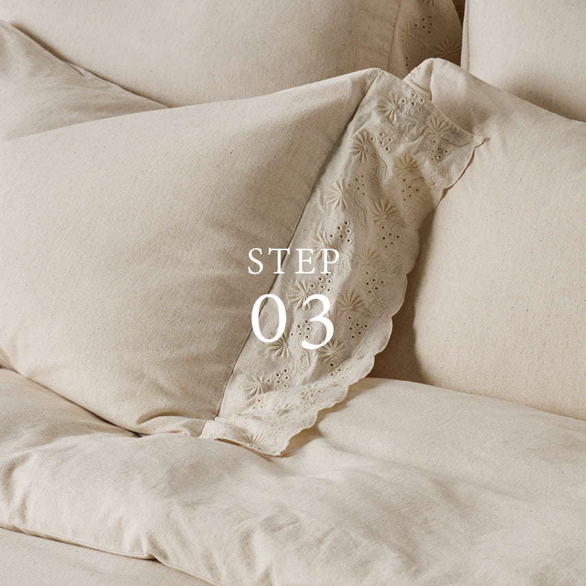 Beige pillow with lace trim on a beige background, labeled 'STEP 03'.  Shop pllow shams.