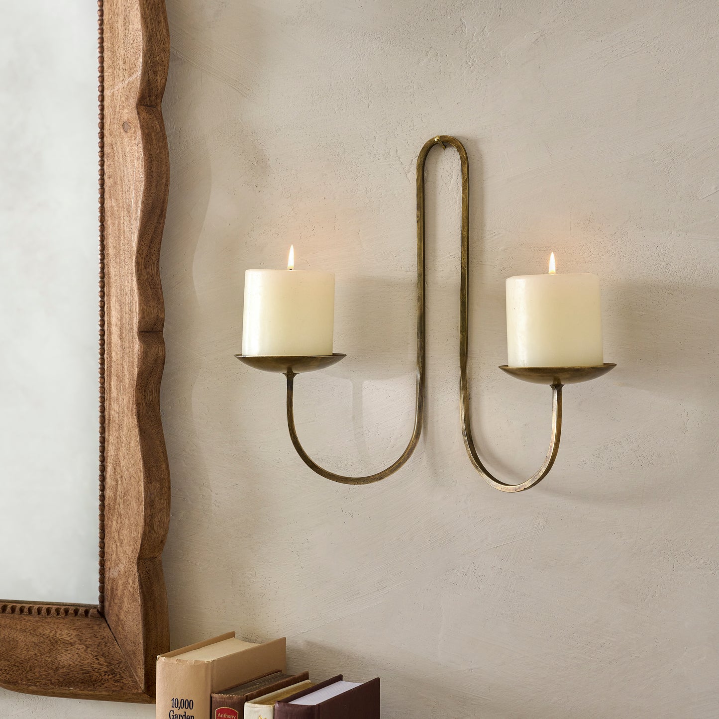 Daniel Antique Brass Candle Sconce shown with candles