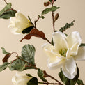 close up detail of faux magnolia floral stem