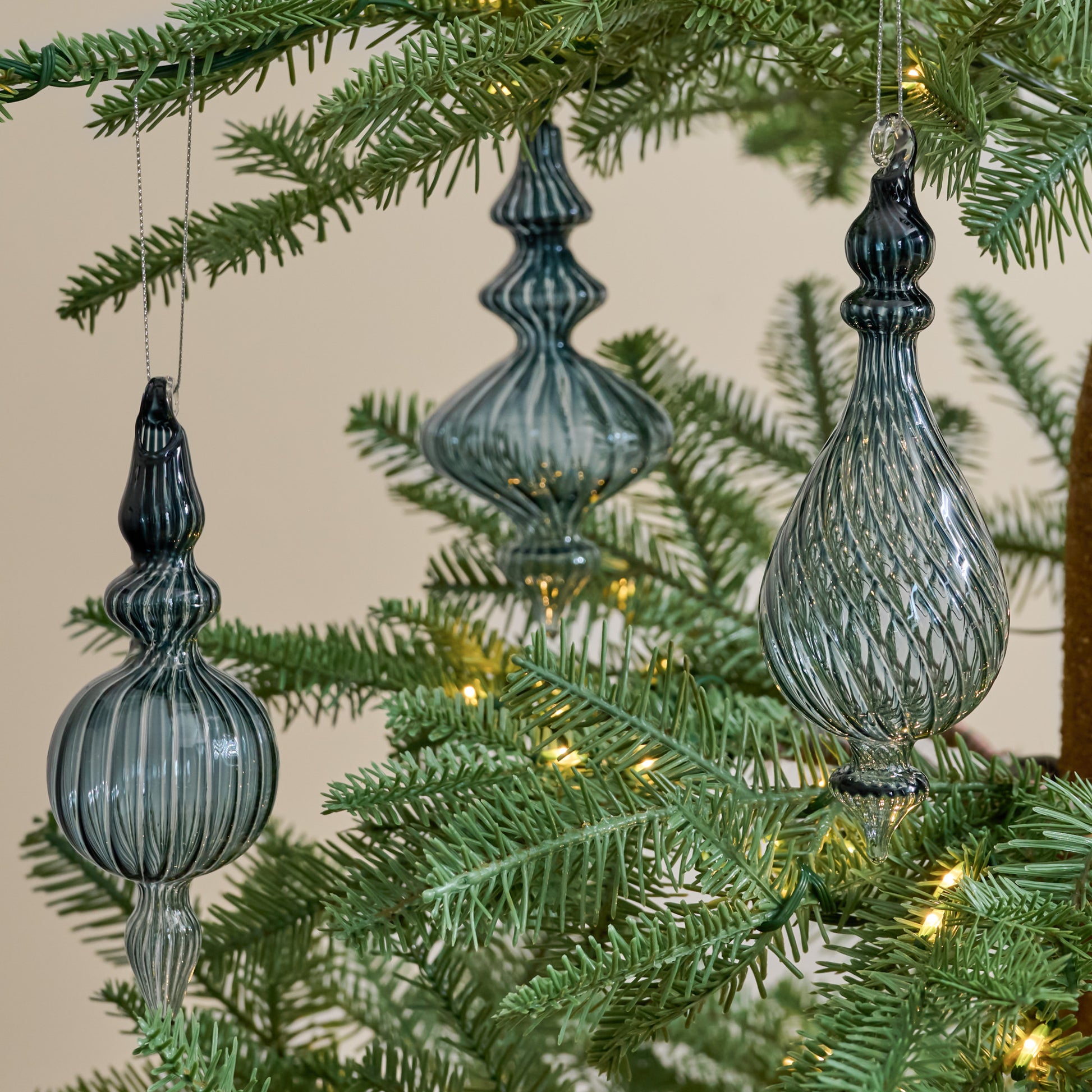 Blue Enchanted Finial Glass Ornaments, Set of 3 shown hung on tree