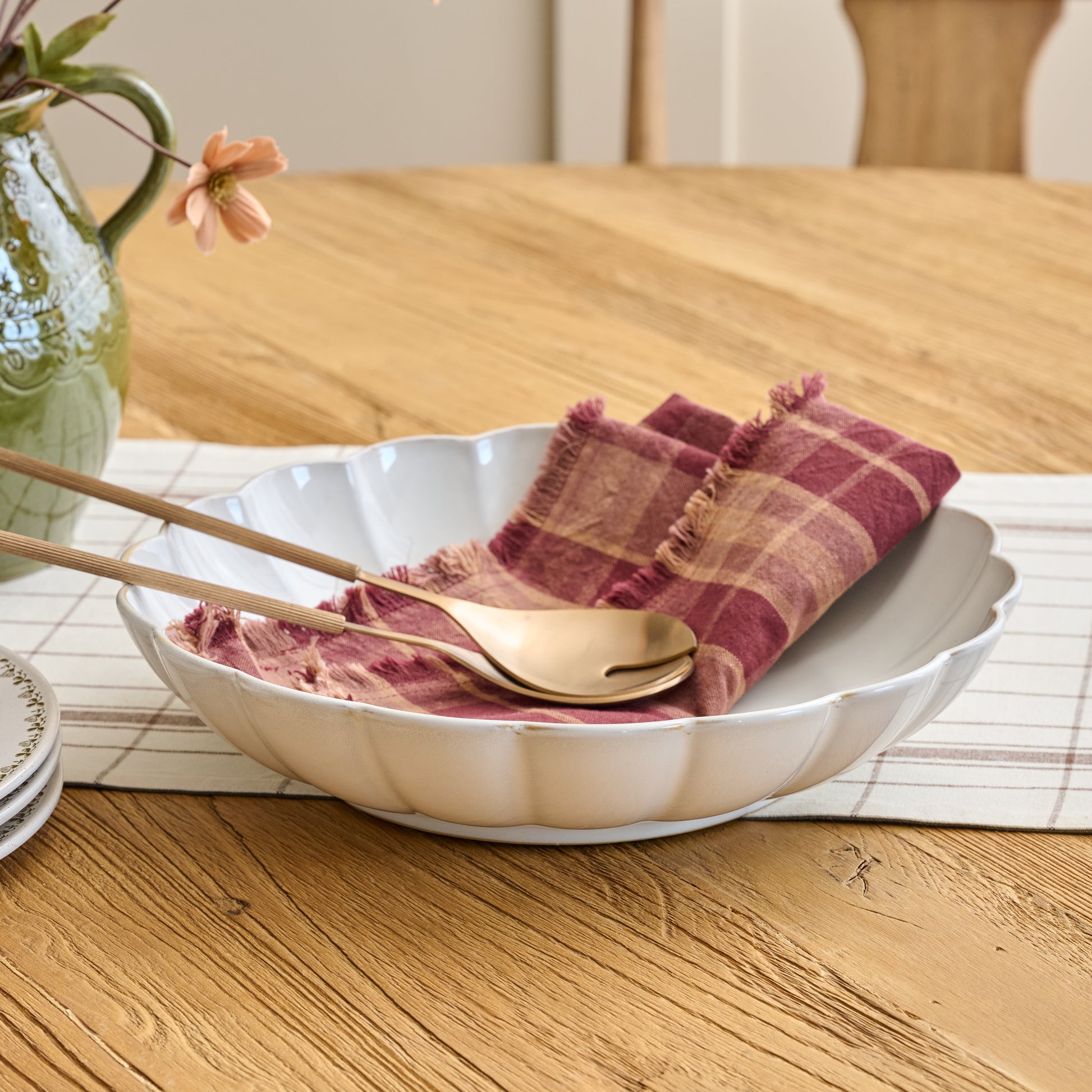Oversized Cream Scalloped Serving Bowl shown on table