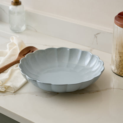 Oversized Grey Scalloped Serving Bowl shown on kitchen counter