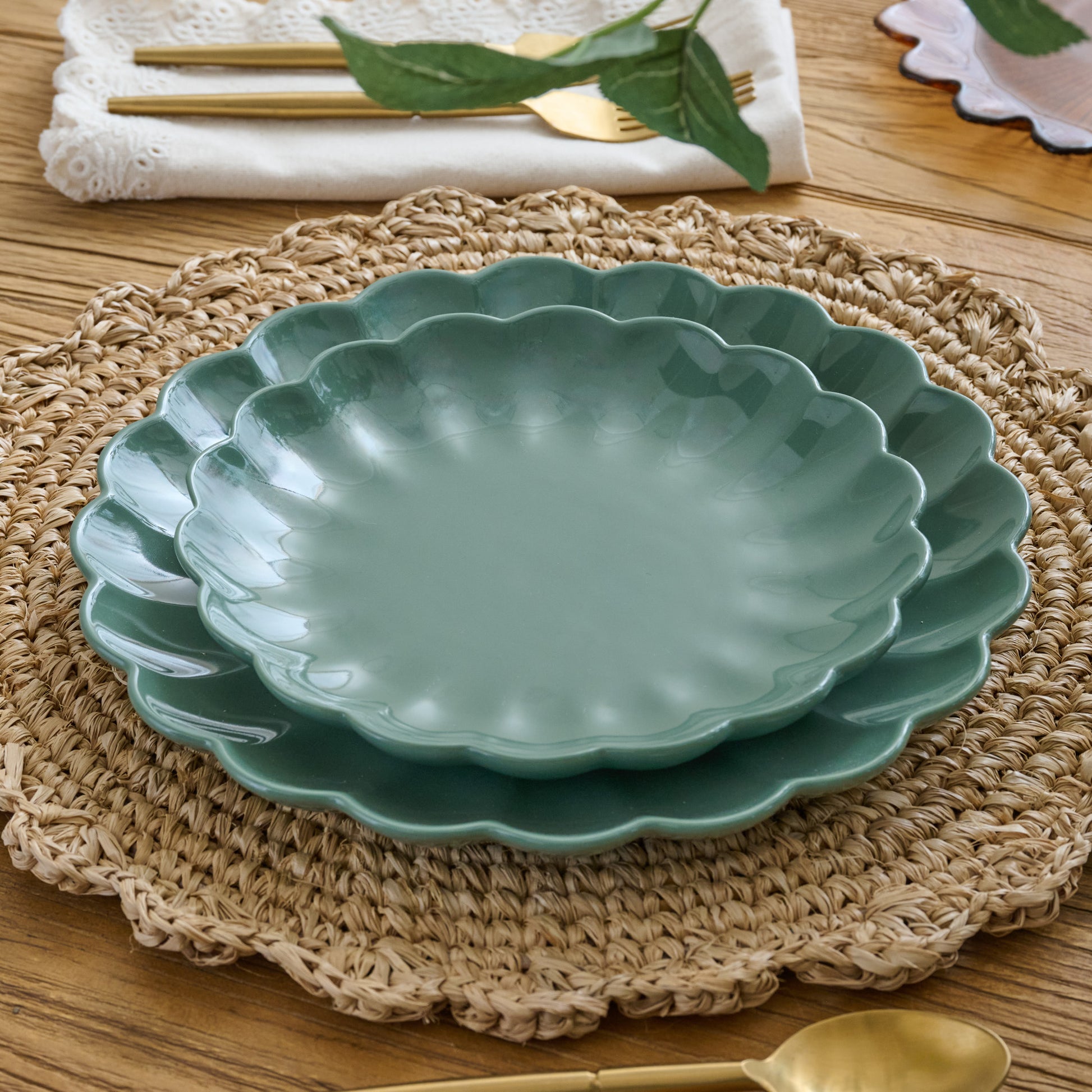 Seagrass Scalloped dessert Plate shown on table