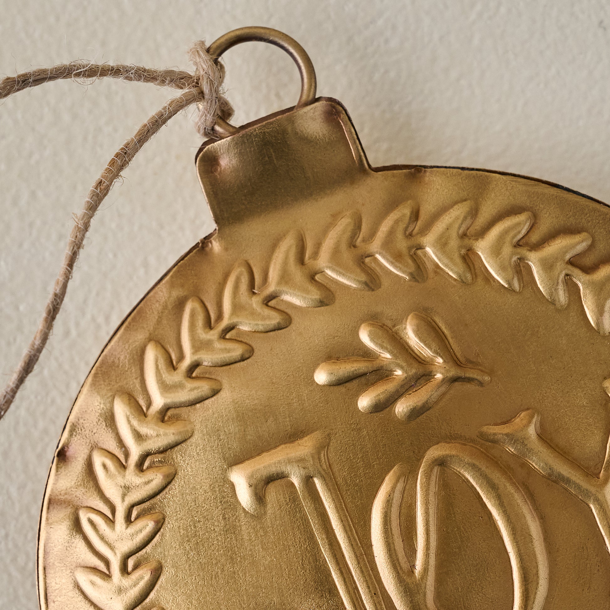 Pressed Metal Joy Ornament up close