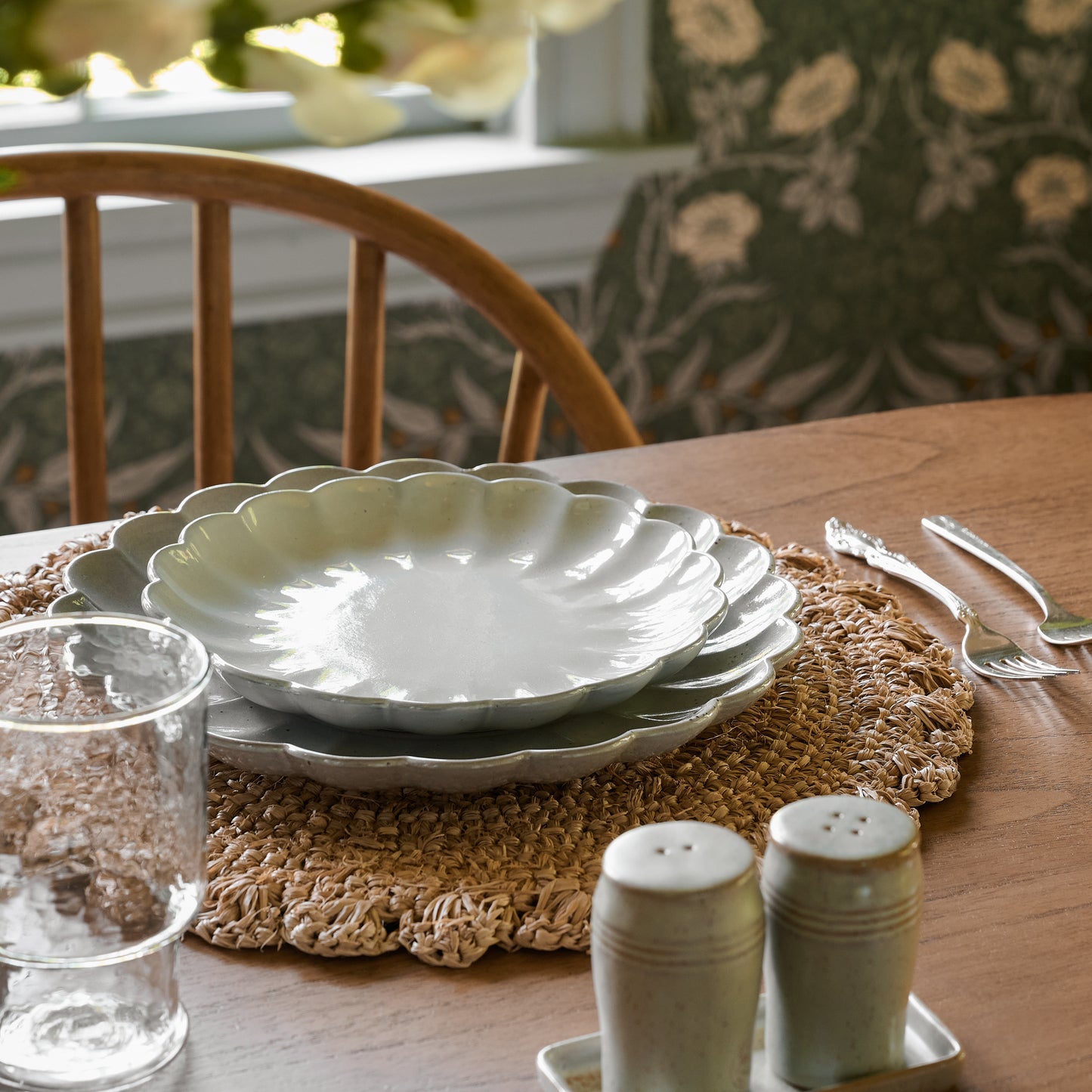 Amelia Round Placemat under plates on a dining table