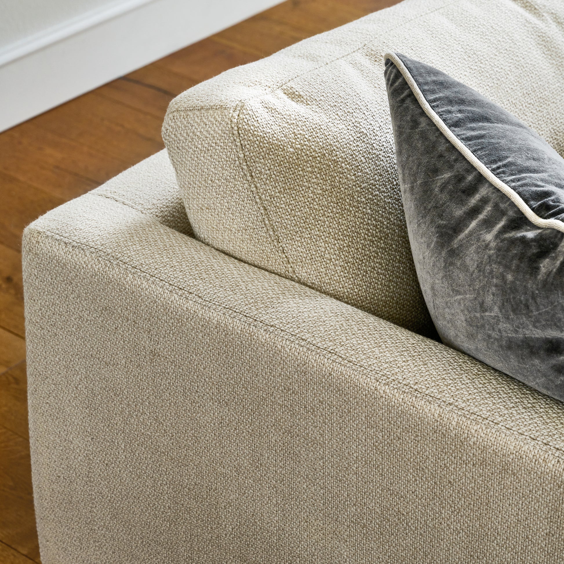 ford sofa close up of top corner of couch with a throw pillow