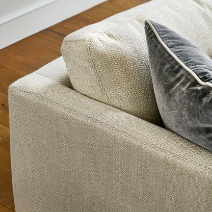 ford sofa close up of top corner of couch with a throw pillow