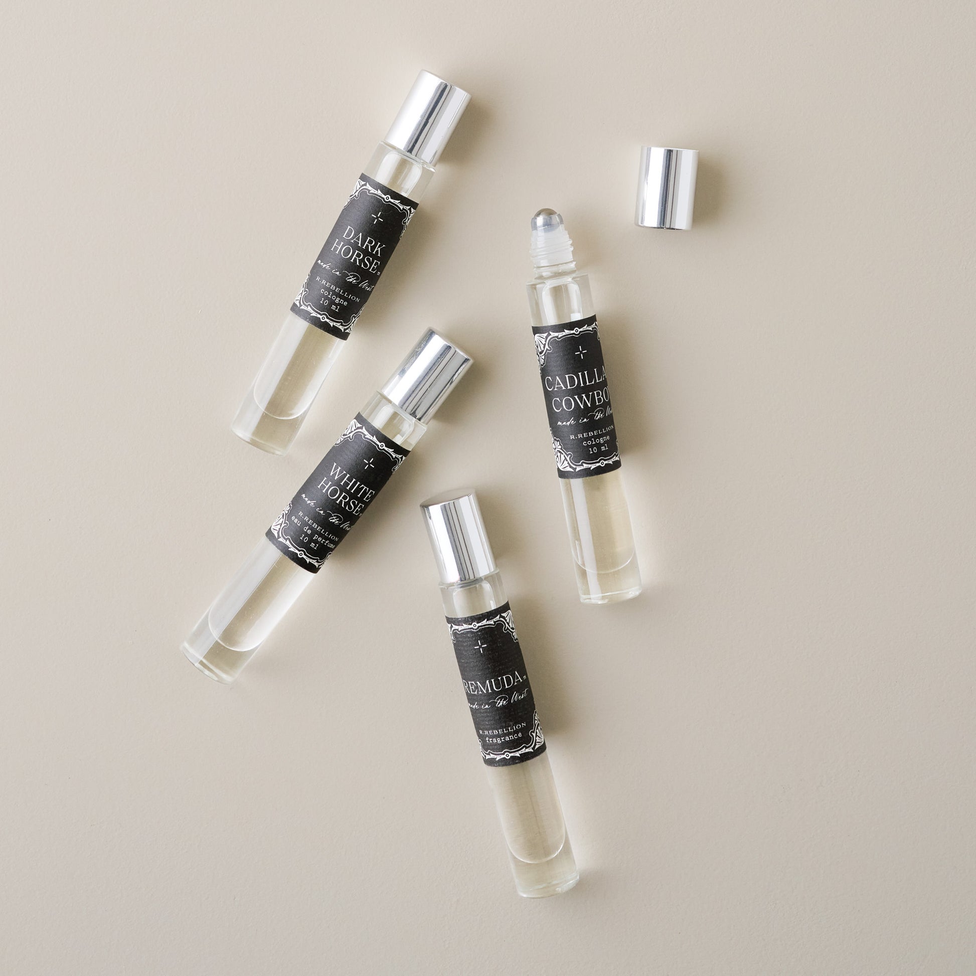 Remuda Roll On Cologne Oil shown with other colognes