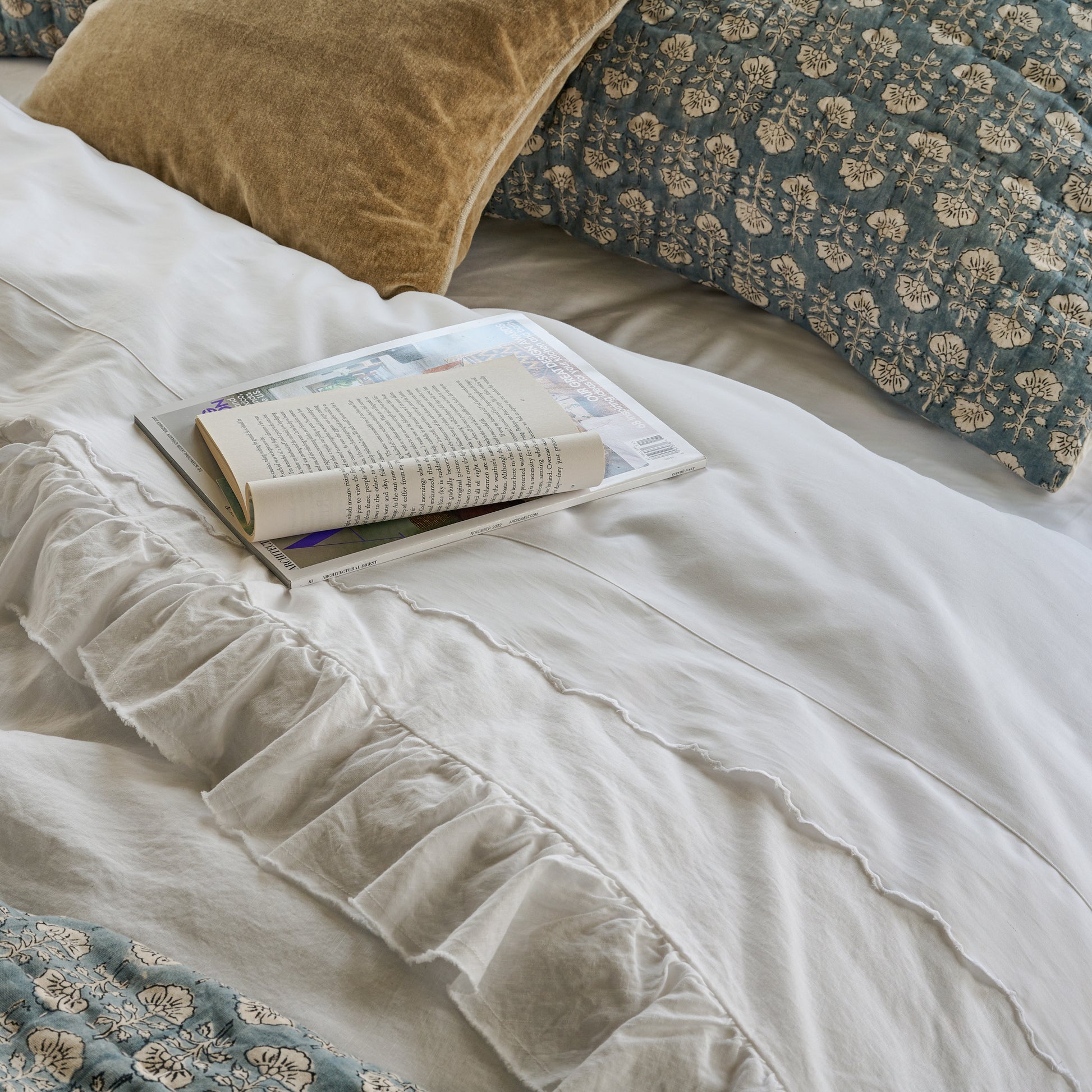 Optic White Scalloped Edge Sheet Set shown on bed