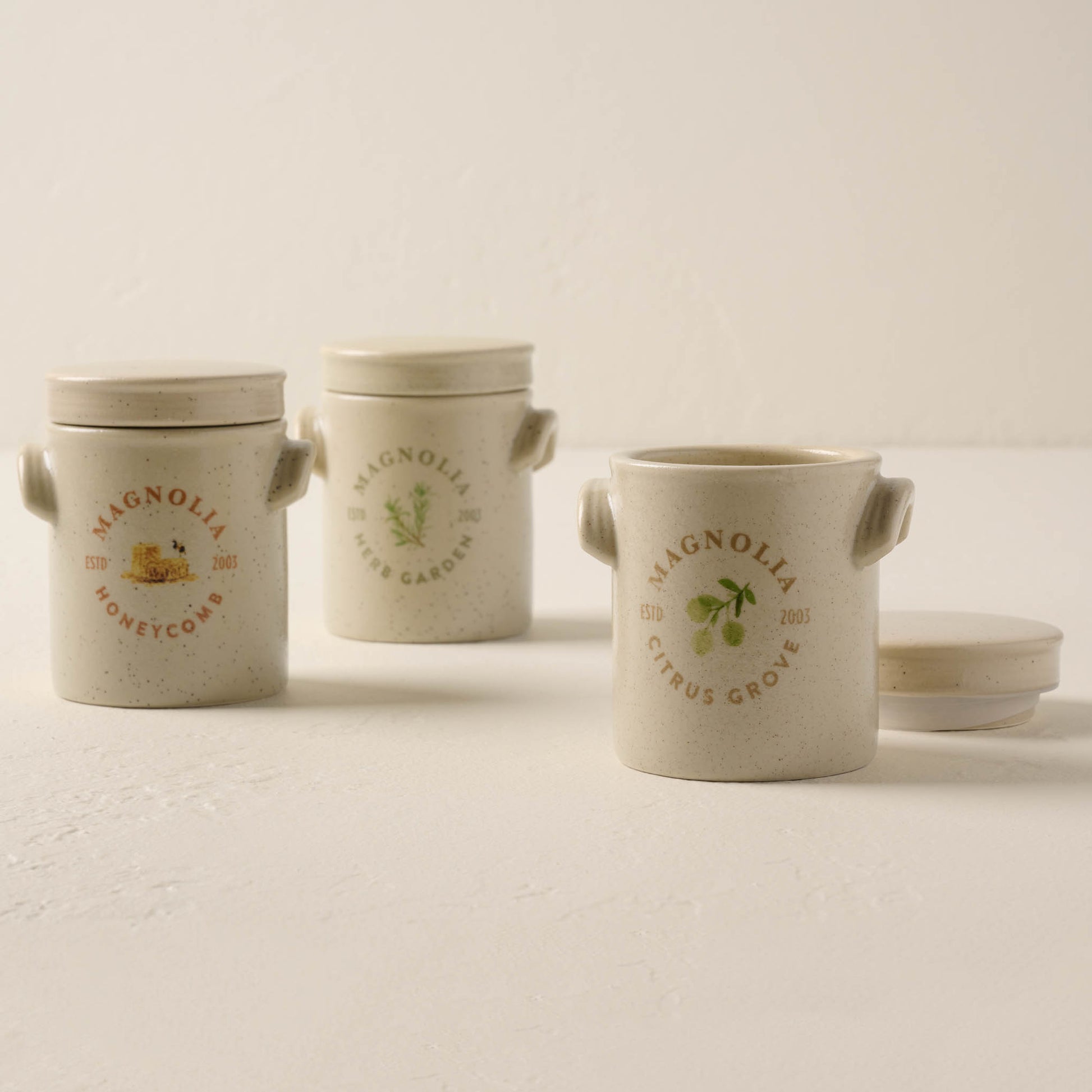 honeycomb candle lined up with herb garden and citrus grove candles