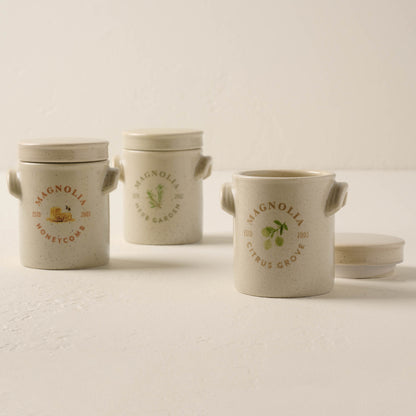 honeycomb candle lined up with herb garden and citrus grove candles