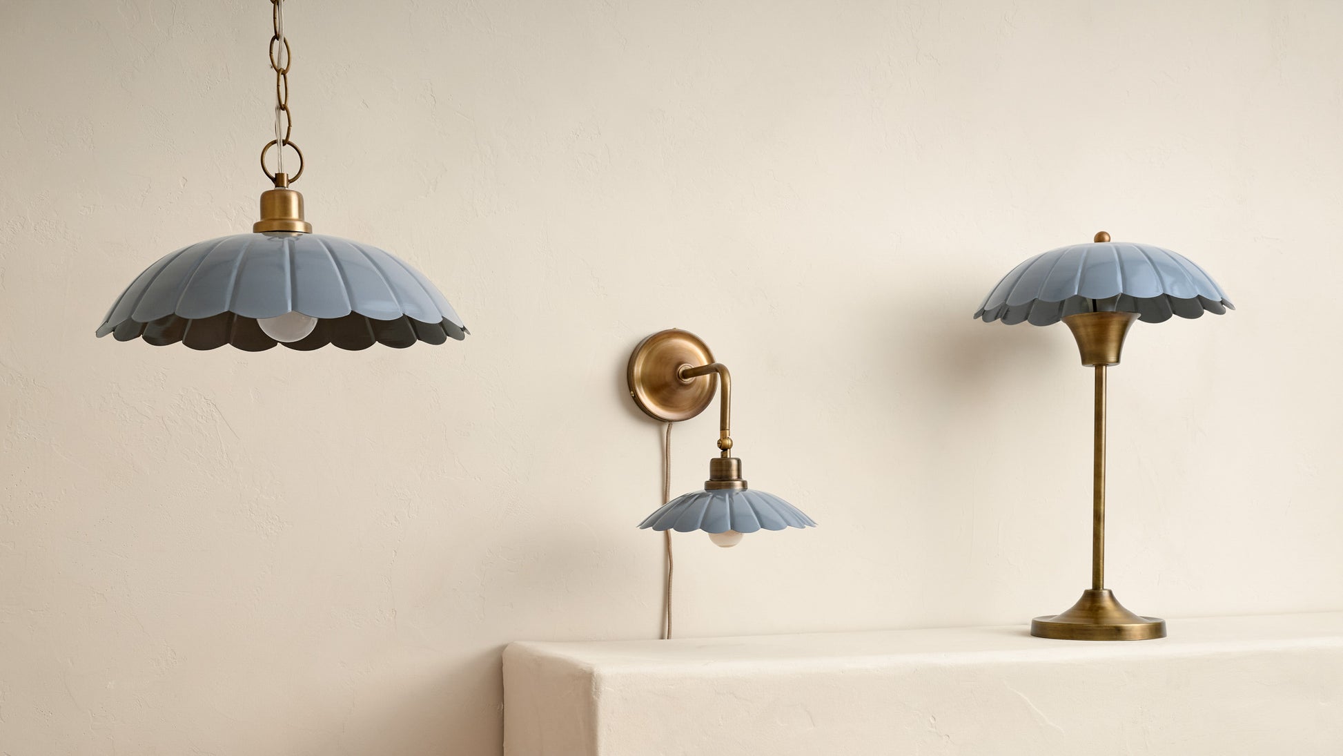 carolyn lighting collection showing a ceiling pendant, wall sconce and lamp