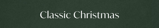 The text 'Classic Christmas' in white serif lettering centered on a dark green textured background.