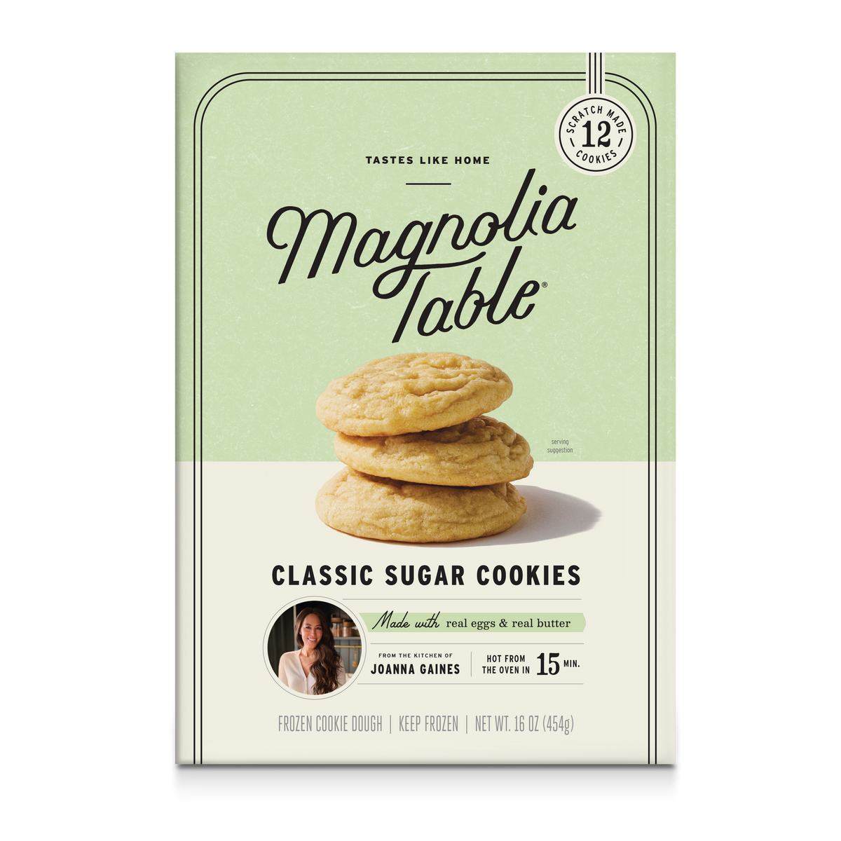 Front of a Magnolia Table Classic Sugar Cookies package, showing a stack of golden-brown cookies on a pale green and cream background with product text and a small photo of Joanna Gaines.