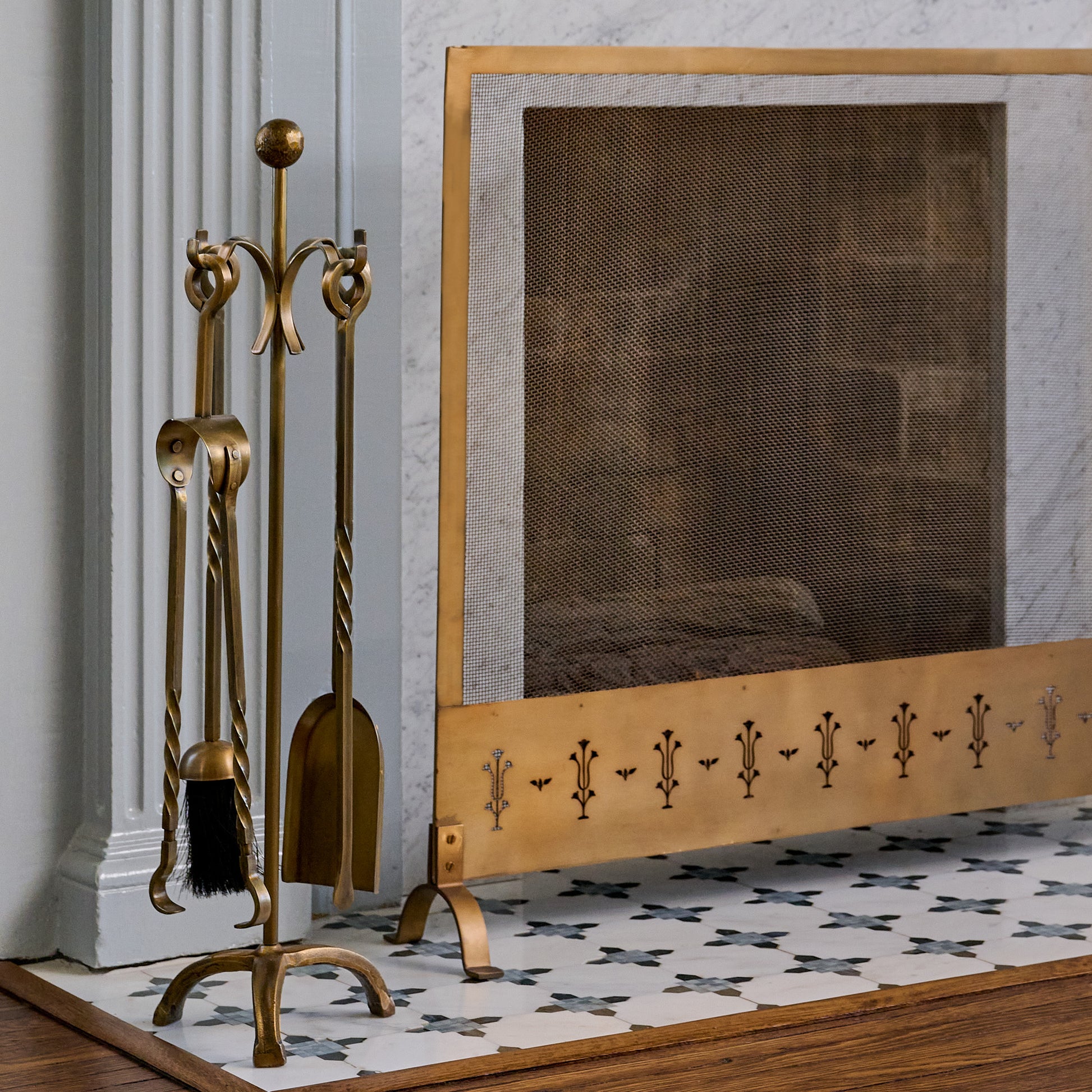 Twisted Antique Brass Fireplace Tool Set shown next to fireplace