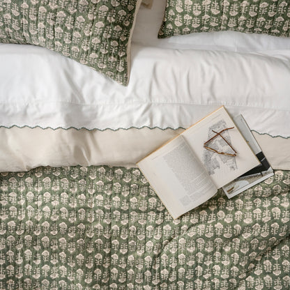 Flora Block Print Sham - Dusty Green shown on bed