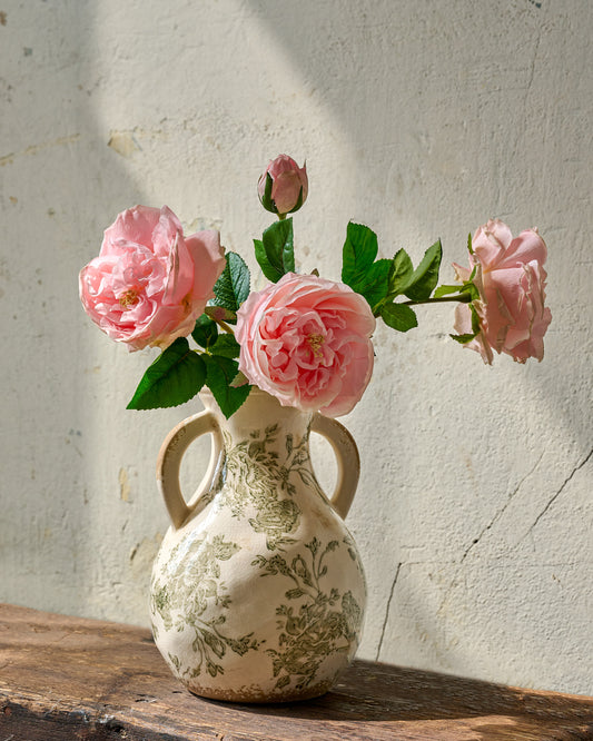 Green and White Distressed Vase with Handle flowers inside