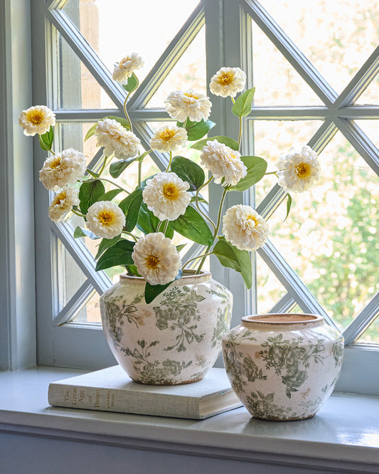 Green and White Distressed Floral Vase in both sizes in a room