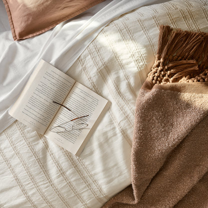 Made bed with Embroidered Oatmeal Stripe Linen Cotton Duvet