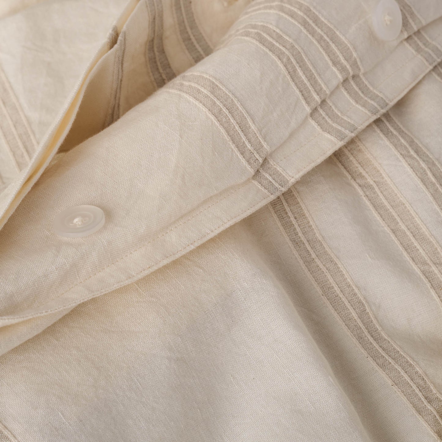 Button detail on Embroidered Oatmeal Stripe Linen Cotton Duvet