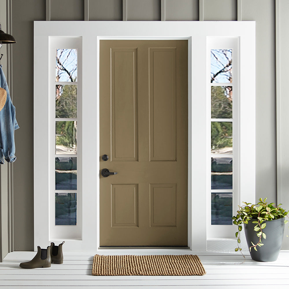 rich green with brown undertone paint color named remote trail shown painted on exterior front door
