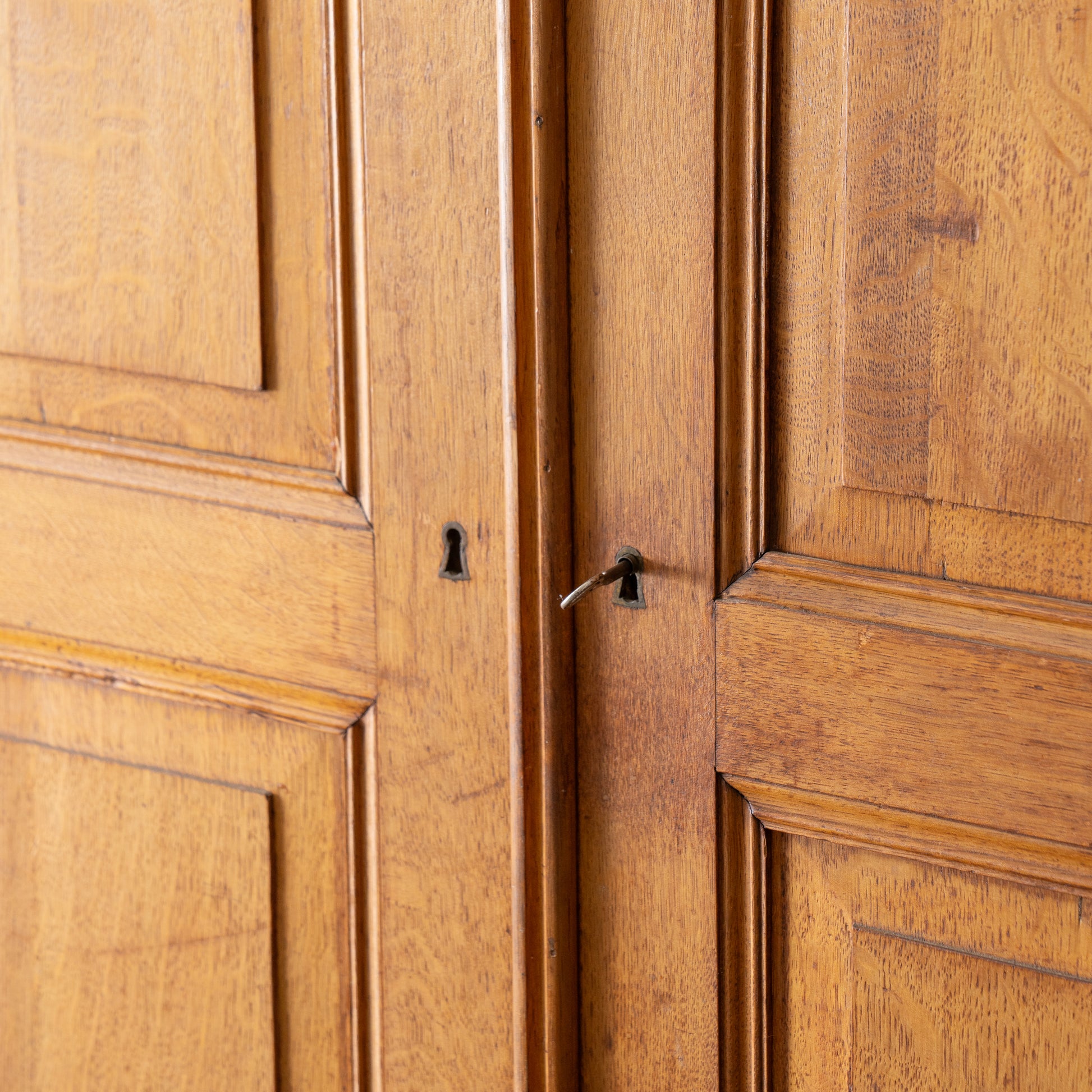 key and lock detail on antique armoire doors