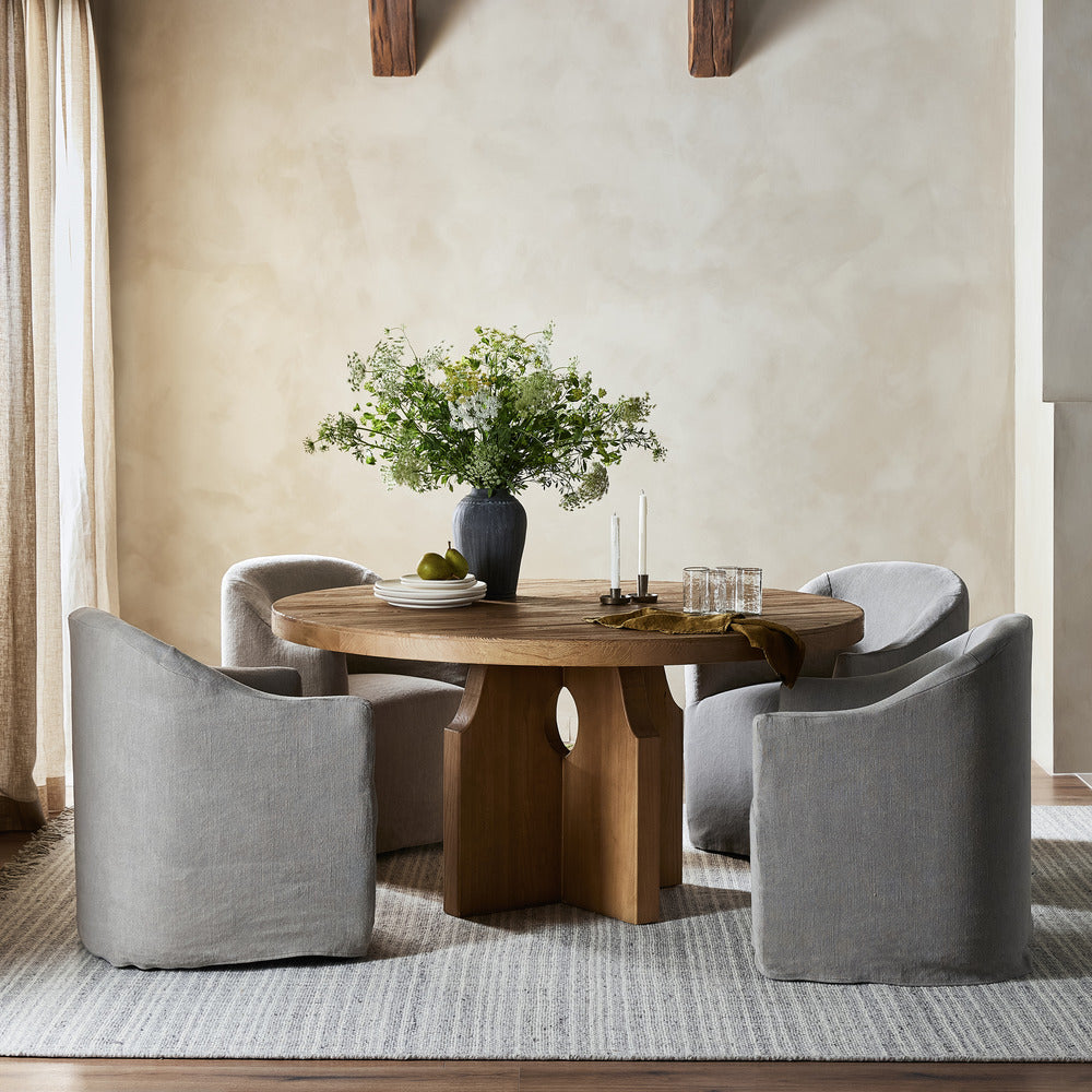 Lyn Dining Chairs around a circular dining table
