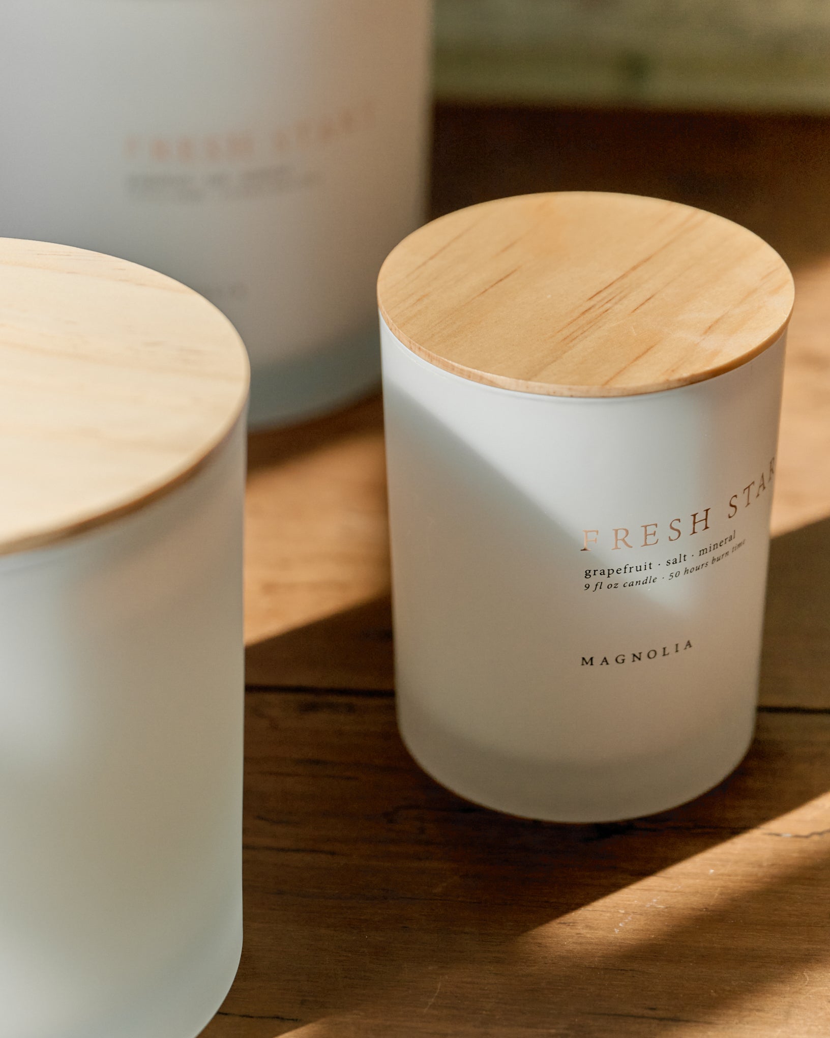 Magnolia Fresh Start Candle angled close up view